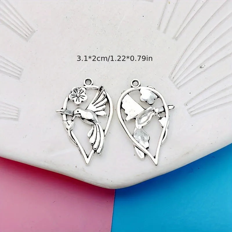Close-up of an alloy cuckoo magpie pendant with electroplated finish in colour P234 for DIY jewellery.