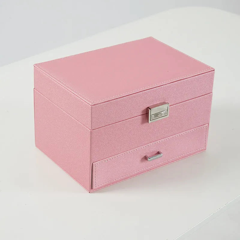 Hard leather jewellery storage box in beige with organiser compartments for rings and necklaces.