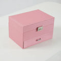 Hard leather jewellery storage box in beige with organiser compartments for rings and necklaces.