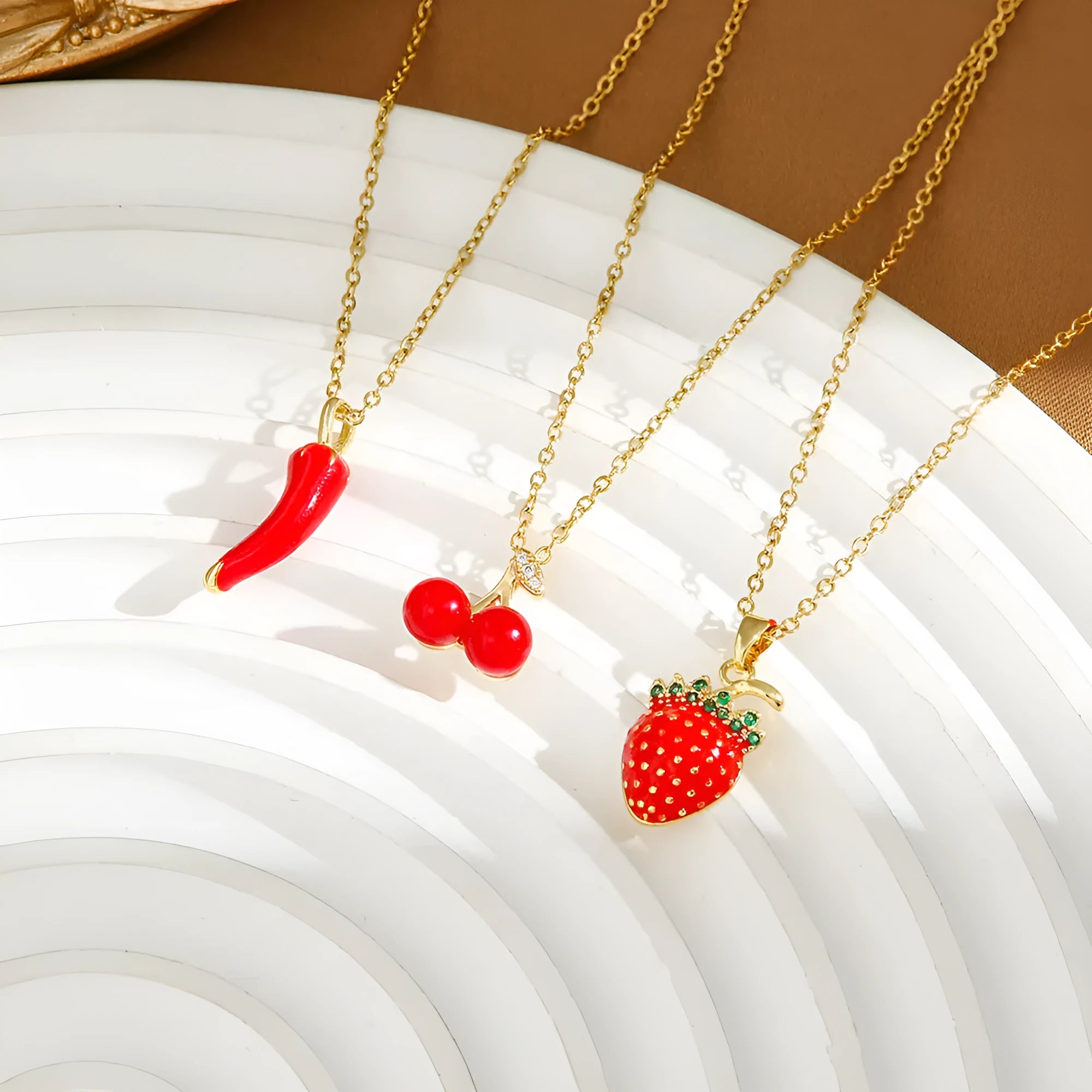Titanium steel fashion necklace with delicate fruit and pepper pendant designs on O-ring chain