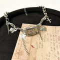 Dark multi-layer cross necklace with twin clavicle chains and hemp flower design on alloy chain