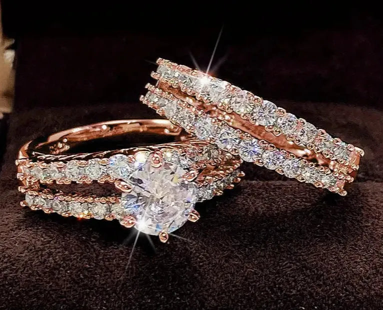 Women's 2-in-1 ring set showing both geometric fashion ring and fully-jewelled ring in gold colour