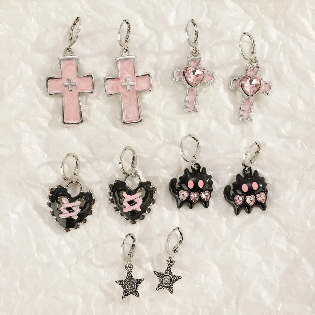 Women's alloy earrings with cross, crystal and character designs in white, black and silver colour variations