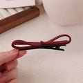 Wine red leather bow barrette hair clip for women, single piece or pair.