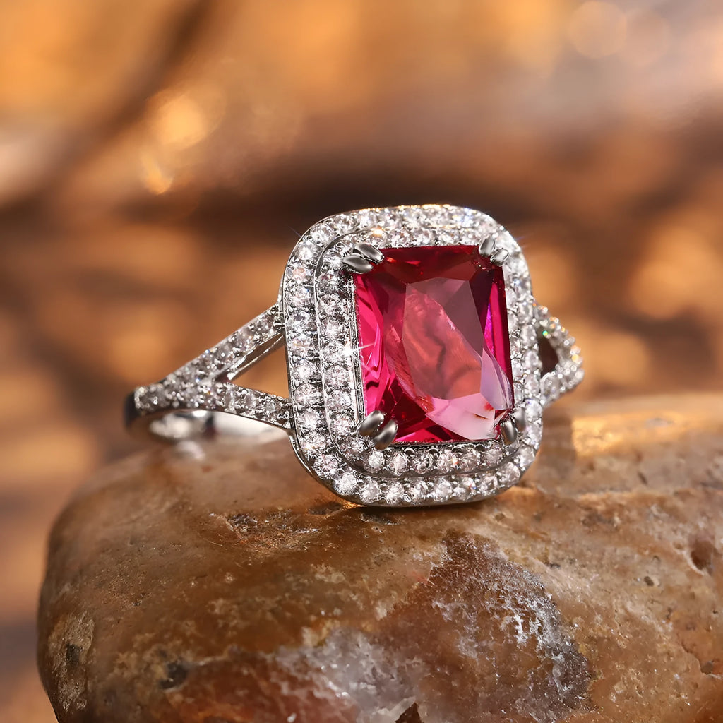 Red copper women's ring with square geometric face and clear rhinestones.
