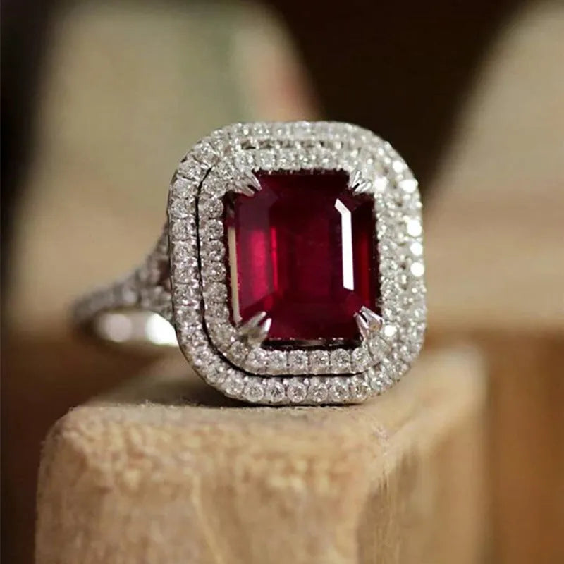Red copper women's ring with square geometric face and clear rhinestones.