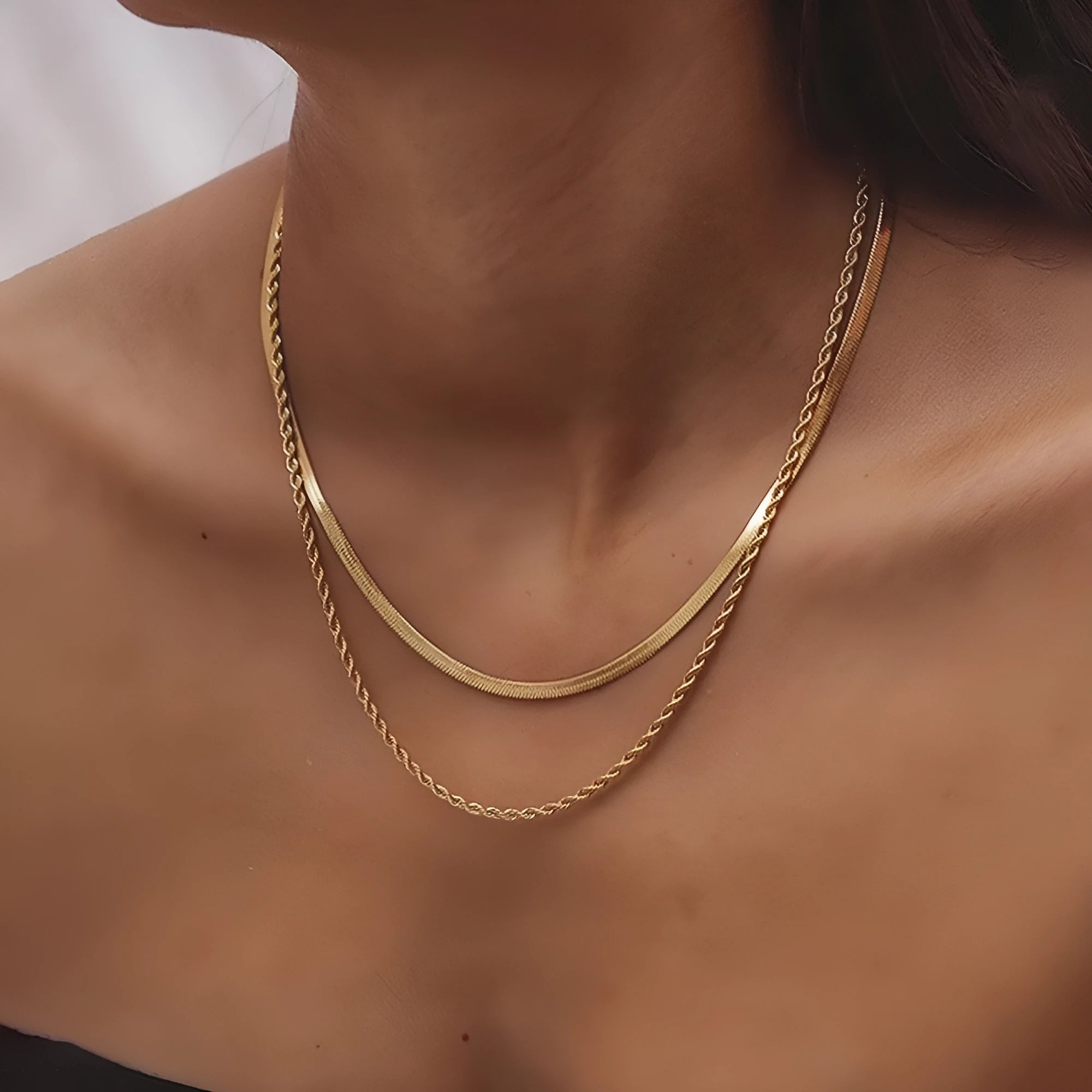 Geometric double layer twist necklace with titanium steel pendant on an adjustable snake bones chain.