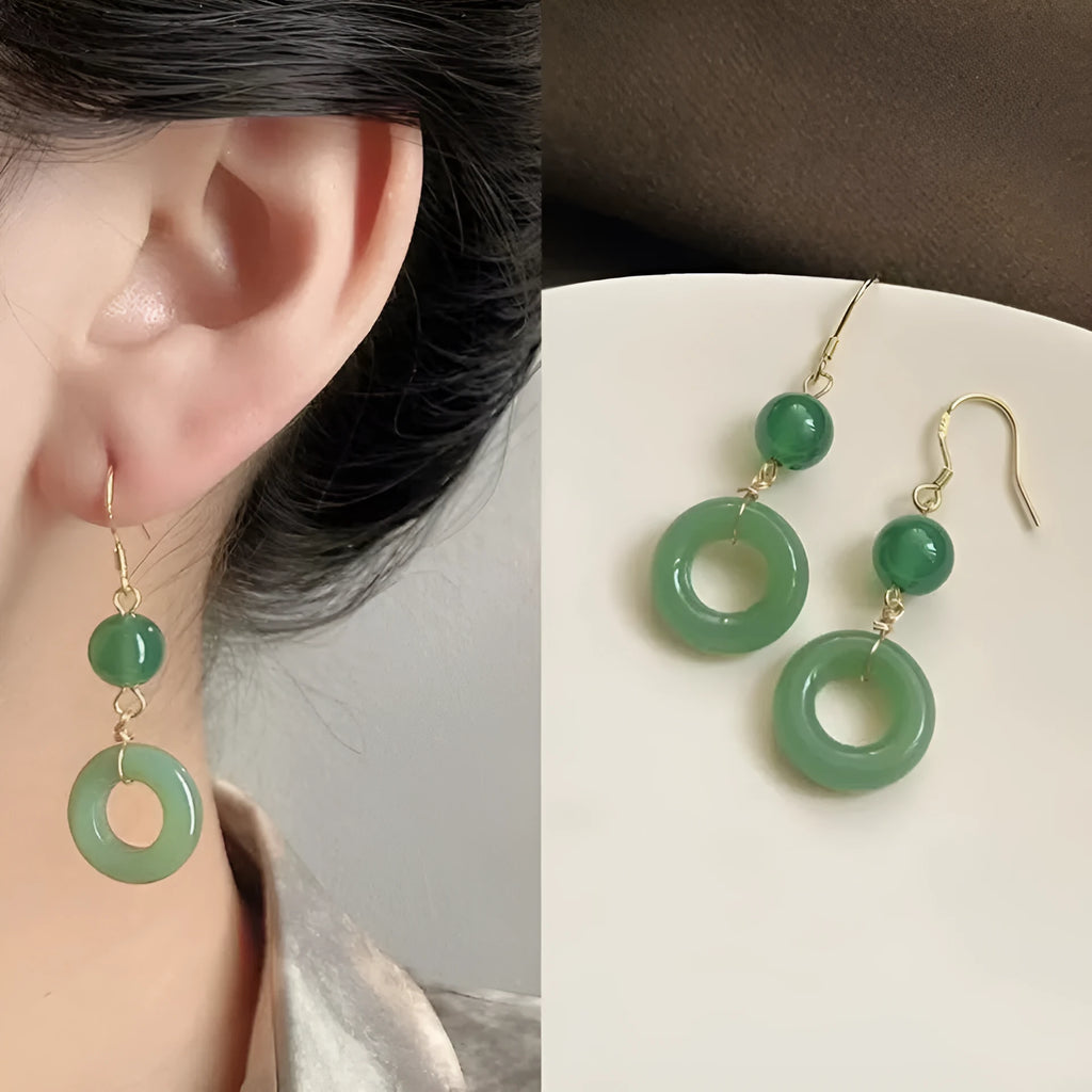 Pair of green Chinese style peace buckle geometric earrings with gold plating.