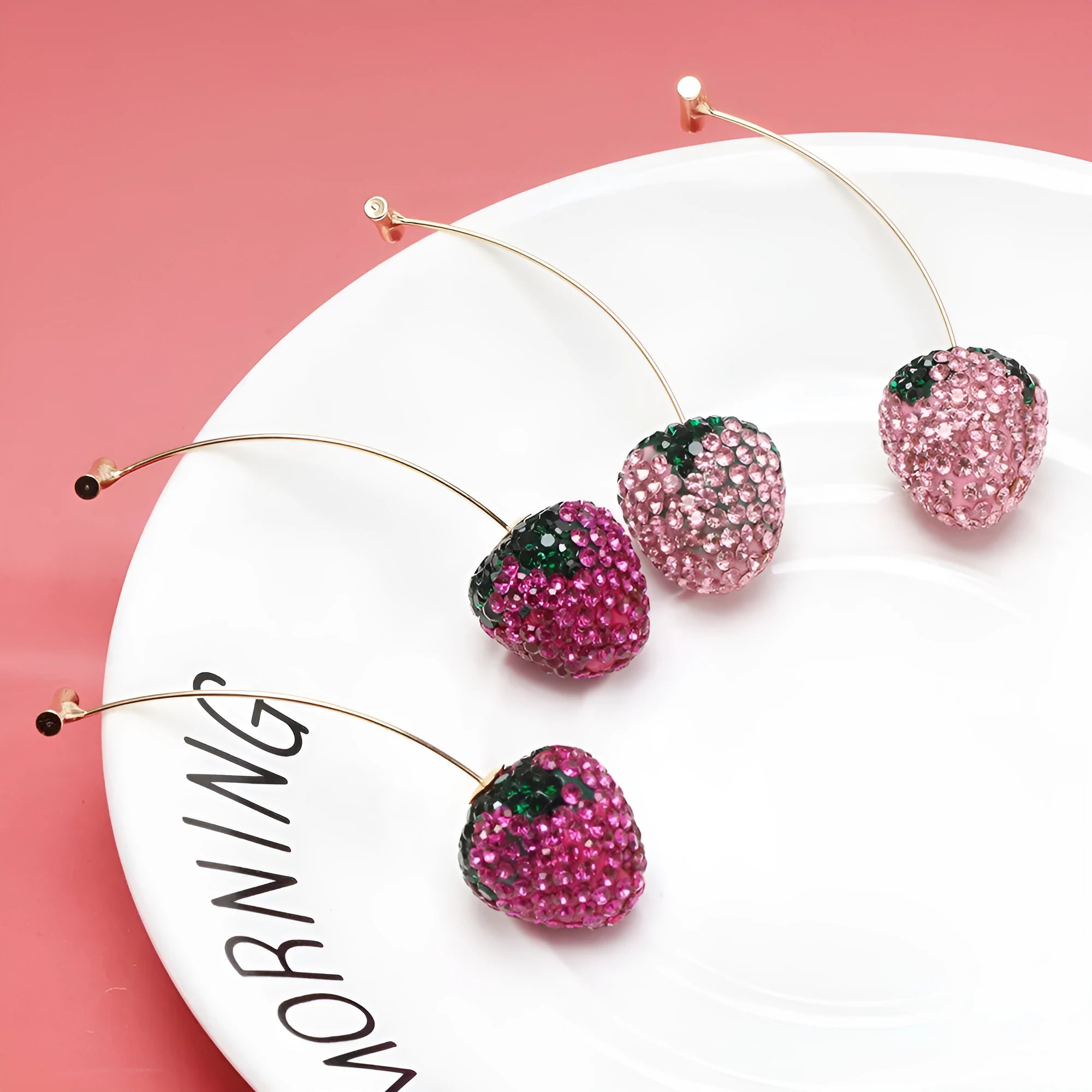 Geometric strawberry-shaped zinc alloy earrings in spot drill red finish.