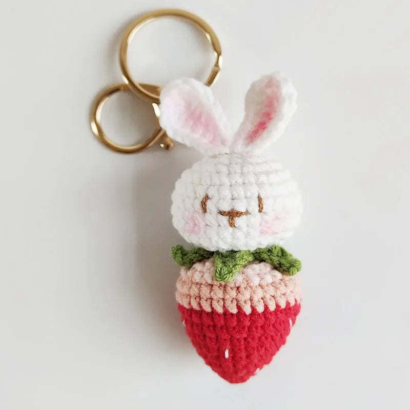 Colourful hand-woven wire rabbit strawberry pendant on a keyring