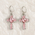 Women's alloy earrings with cross, crystal and character designs in white, black and silver colour variations