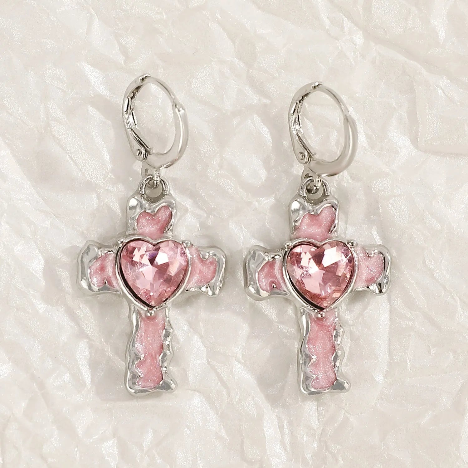 Women's alloy earrings with cross, crystal and character designs in white, black and silver colour variations
