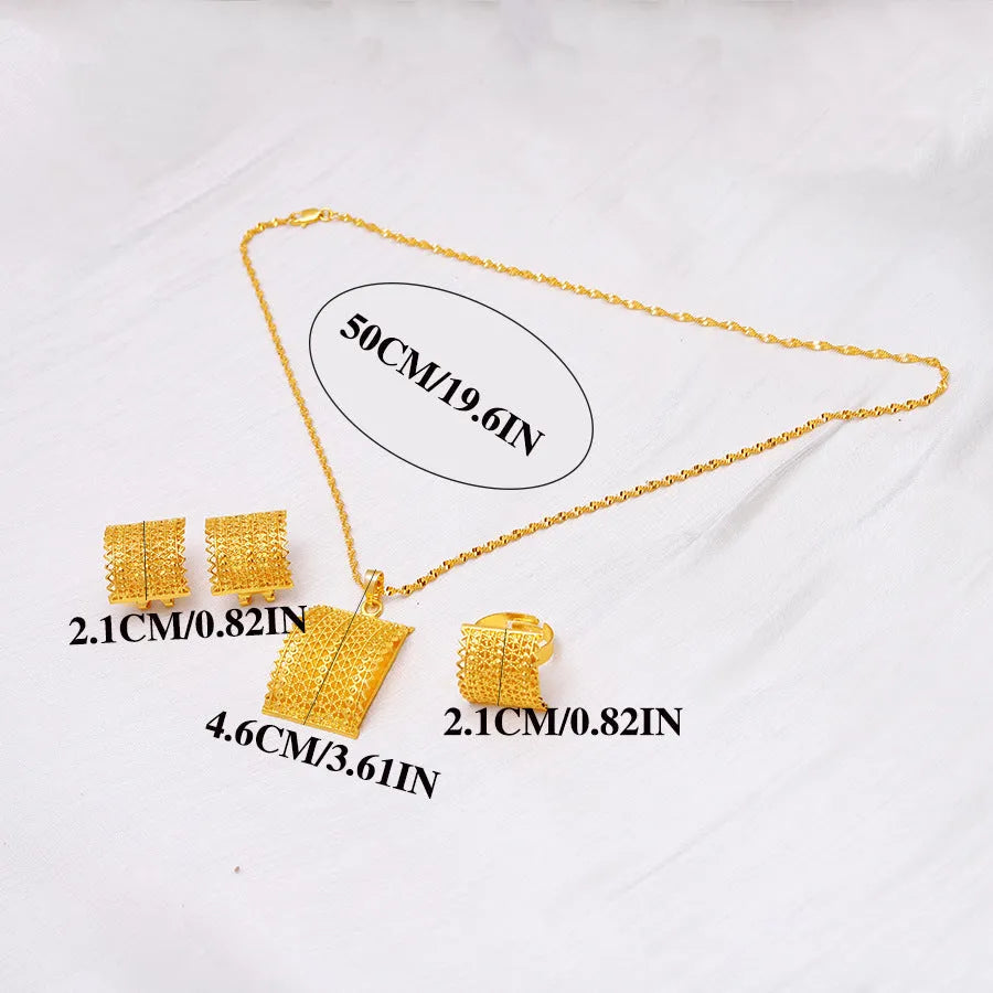 Gold tone wedding jewellery set showing necklace, earrings and ring on display