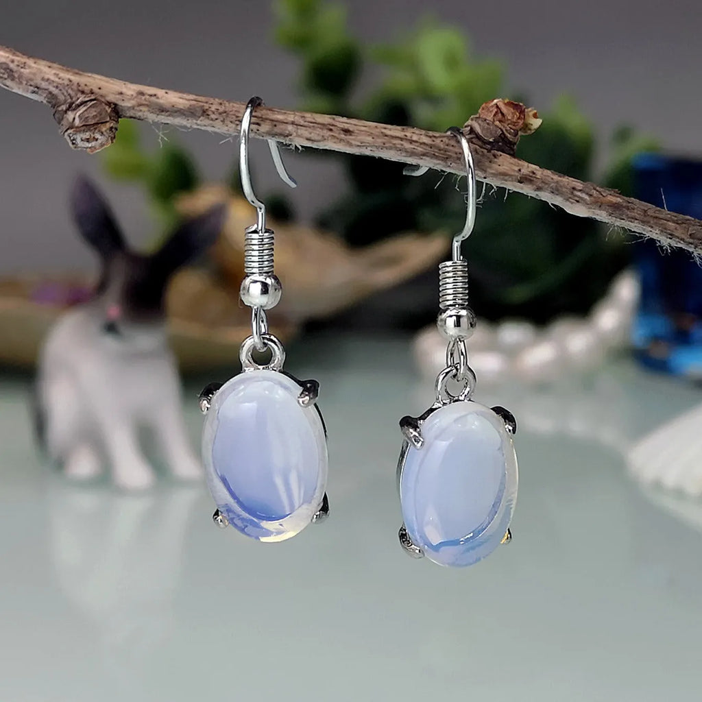 Moonlight white opal earrings with retro drop shape design and ellipse elements
