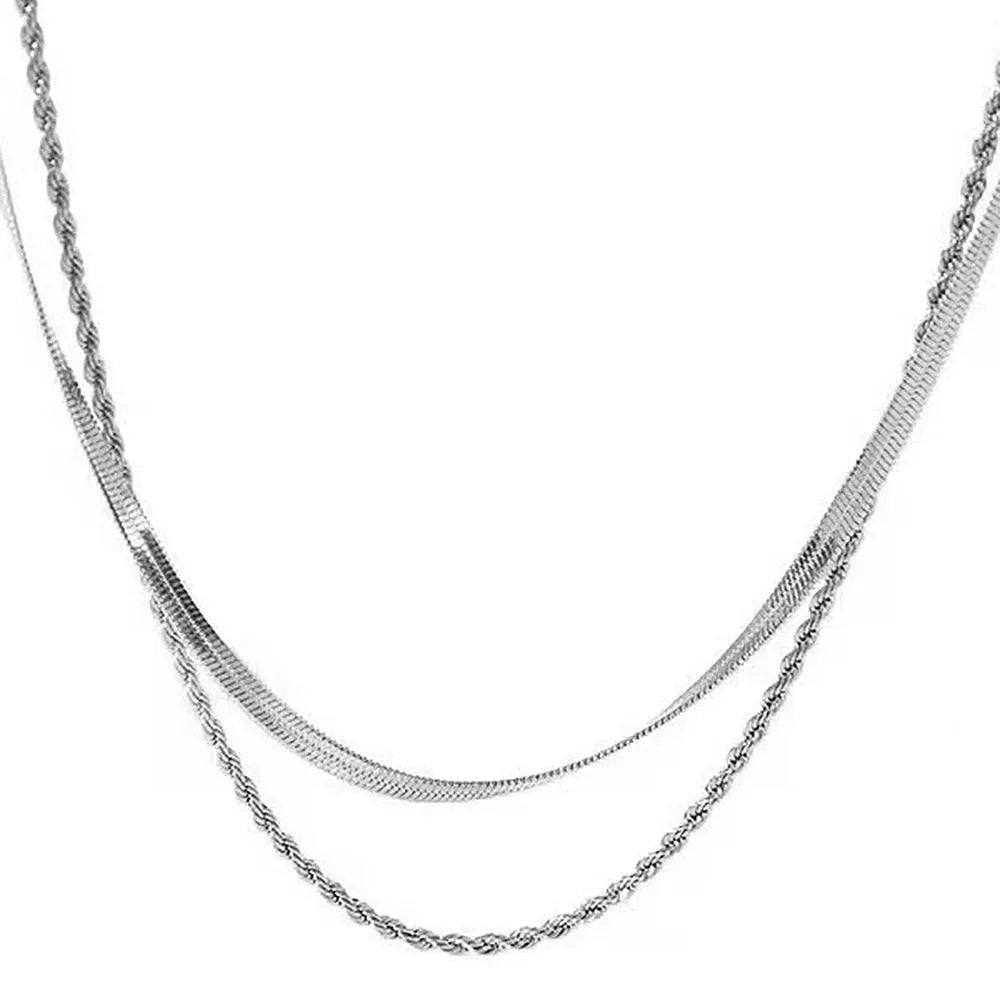 Geometric double layer twist necklace with titanium steel pendant on an adjustable snake bones chain.