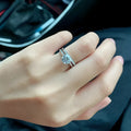 Silver heart-shaped couple rings with dragon phoenix design and adjustable opening showing moissanite stones