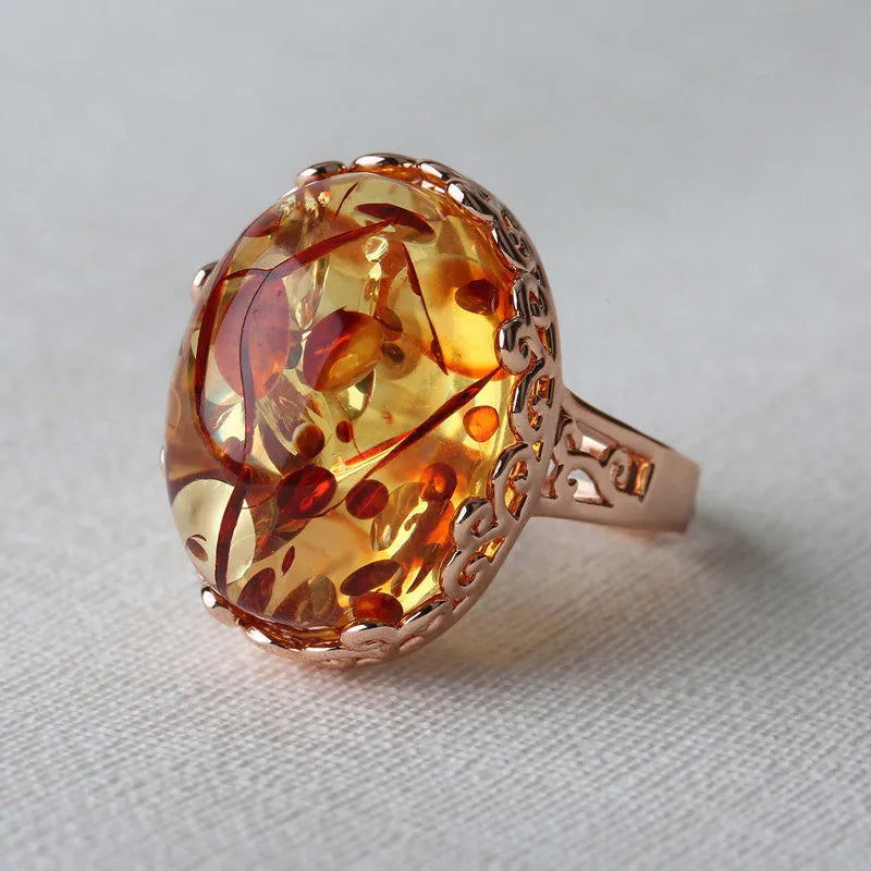 Beeswax amber ring with an alloy band in an ethnic style, colour New Amber Type A.
