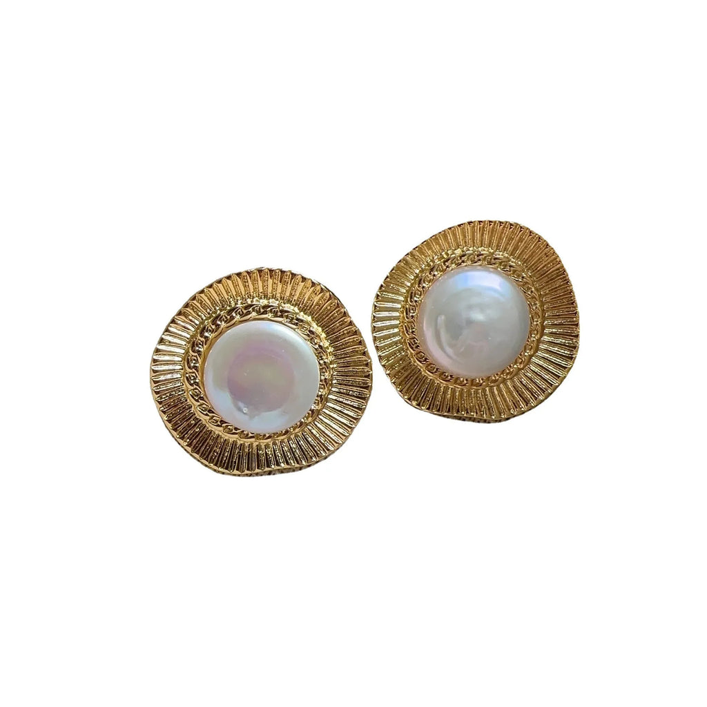 Gold round retro earrings for women with metal construction and circular design
