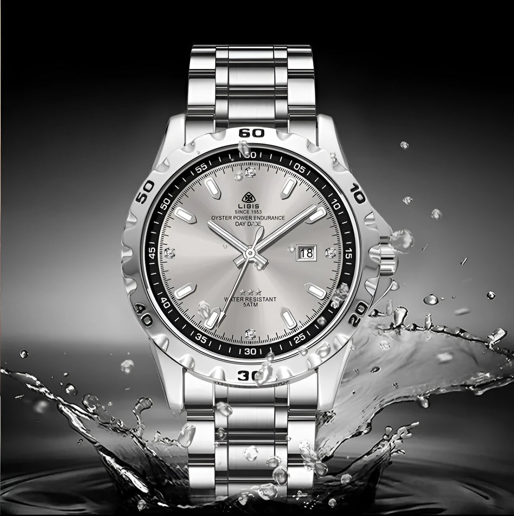 Men's silver quartz watch with luminous hands and stainless steel strap on wrist