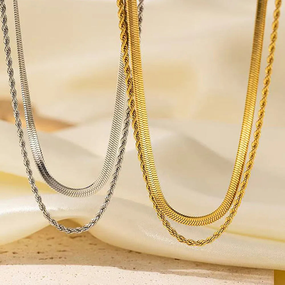 Geometric double layer twist necklace with titanium steel pendant on an adjustable snake bones chain.