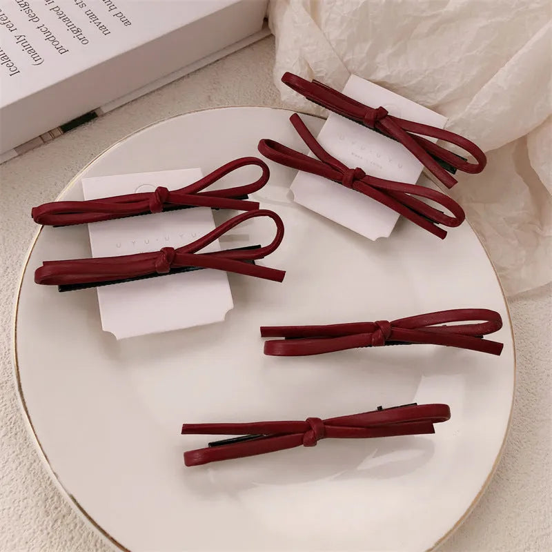 Wine red leather bow barrette hair clip for women, single piece or pair.