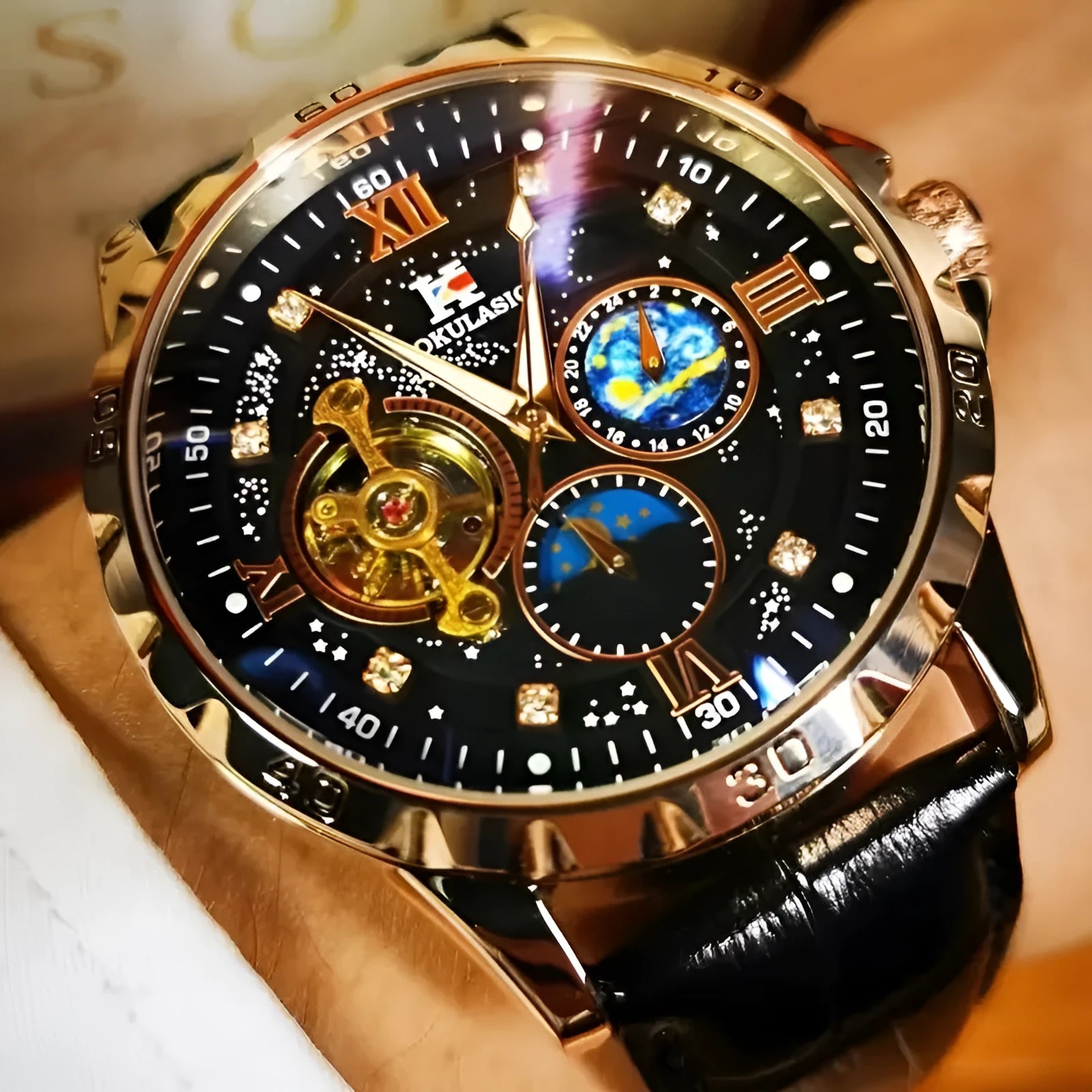 Men's black and rose gold automatic skeleton watch on leather strap.