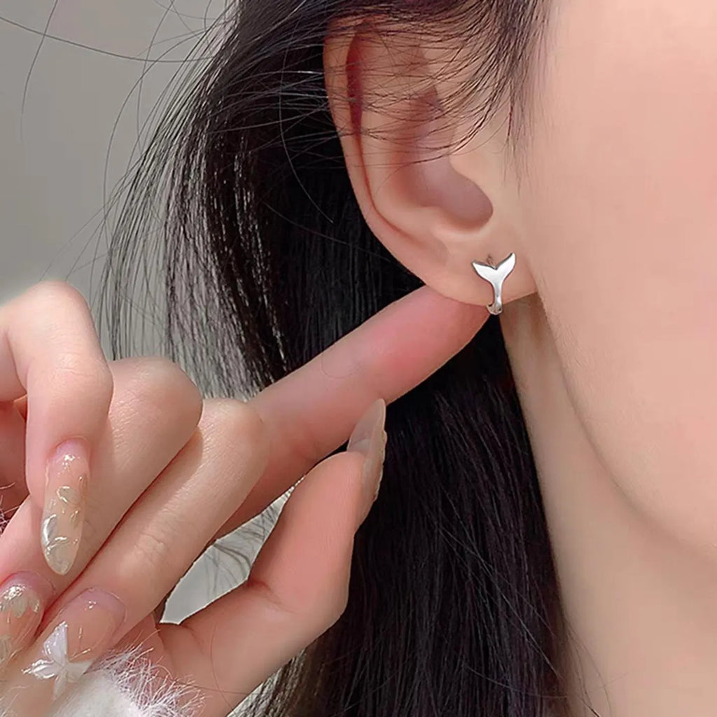 Women's fishtail design copper earrings with electroplated finish in white gold or yellow gold colour