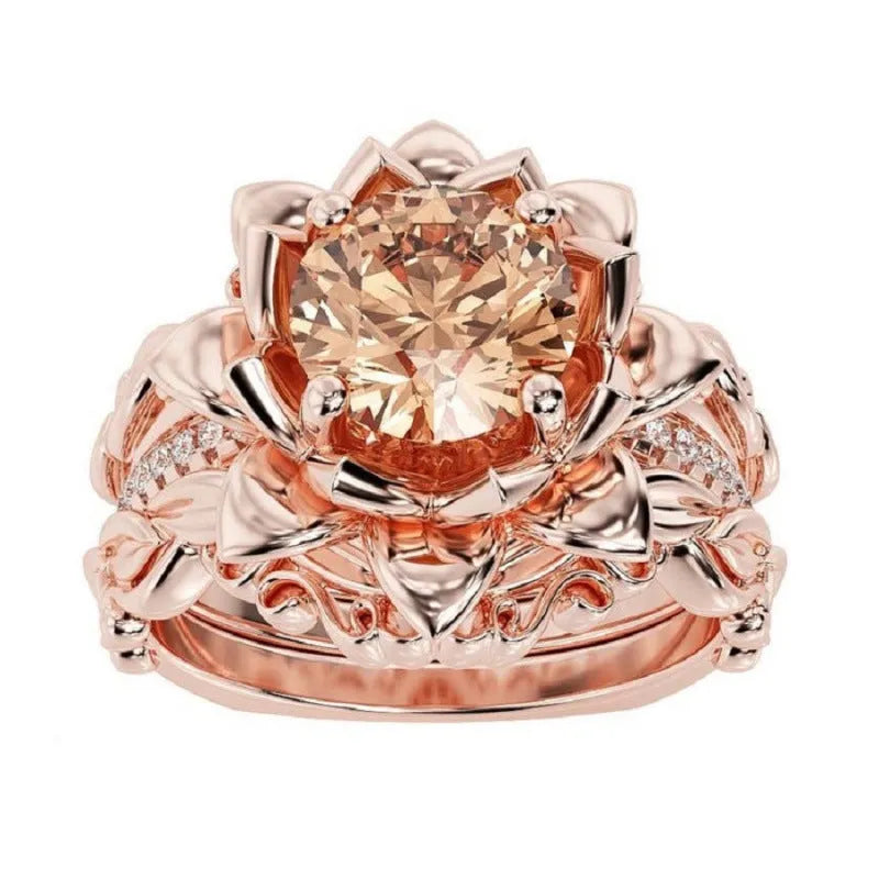 Women's geometric alloy ring with rose motif and zircon inlay, shown in rose gold, black rhinestone, and pink diamond electroplated finishes.
