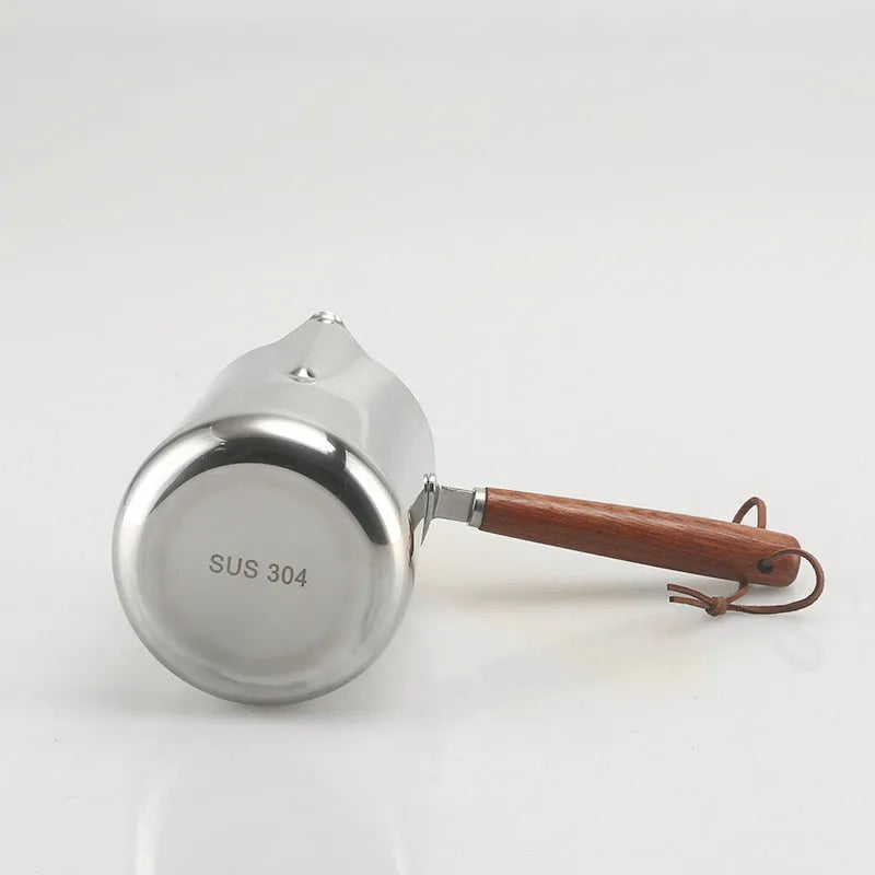 Stainless steel coffee cup with wooden scaled handle showing measurement markings