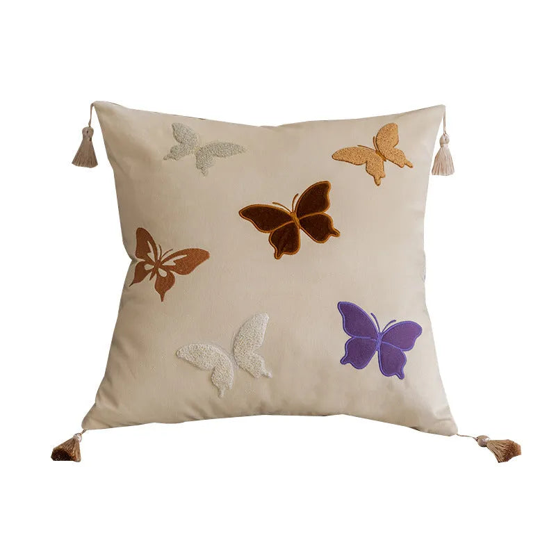 Square beige cushion with detailed black and purple butterfly embroidery in a Chinese style.