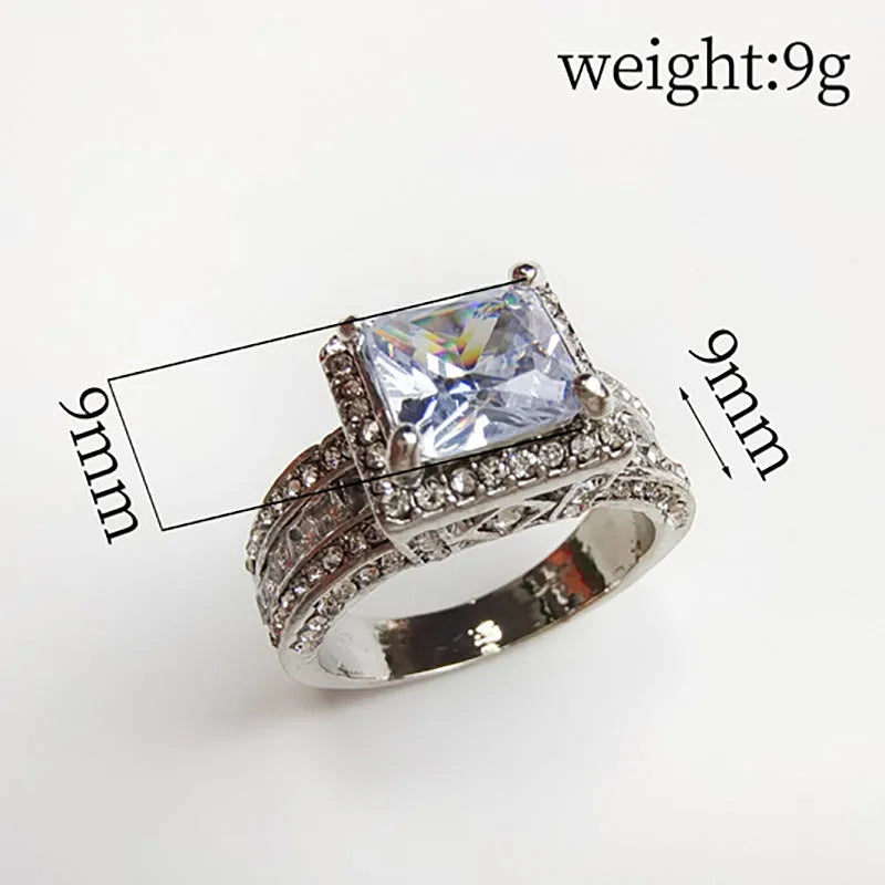 Geometric silver fashion ring for women on a hand, shown in both gold and white colour options.