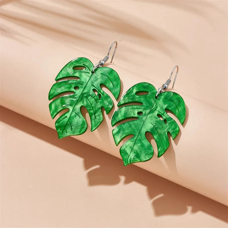 Alloy drop earrings with a blue acrylic artocarpus heterophyllus design and hook fastening.