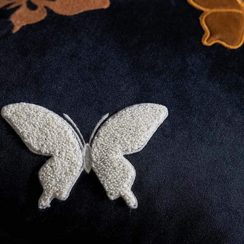 Square beige cushion with detailed black and purple butterfly embroidery in a Chinese style.