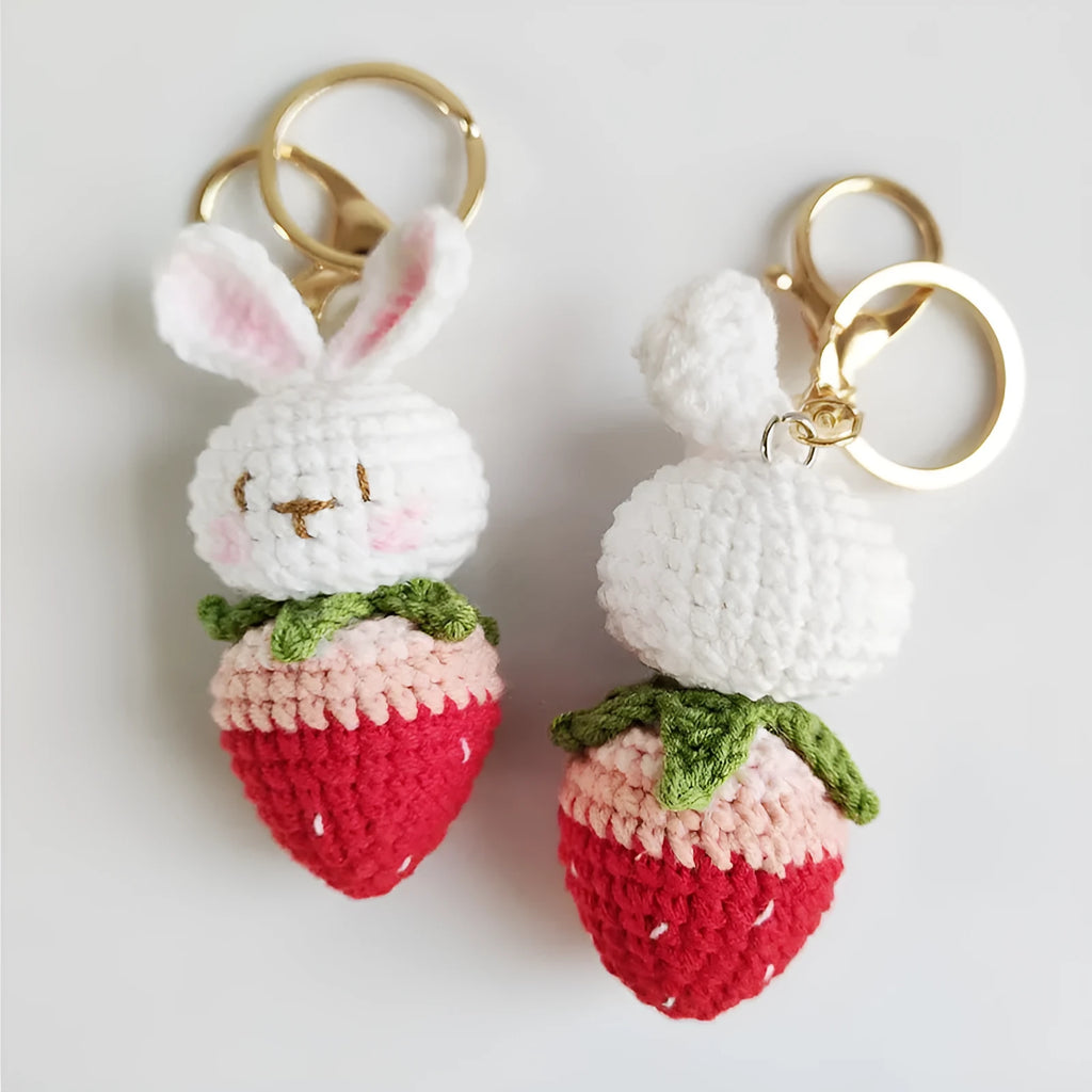 Colourful hand-woven wire rabbit strawberry pendant on a keyring