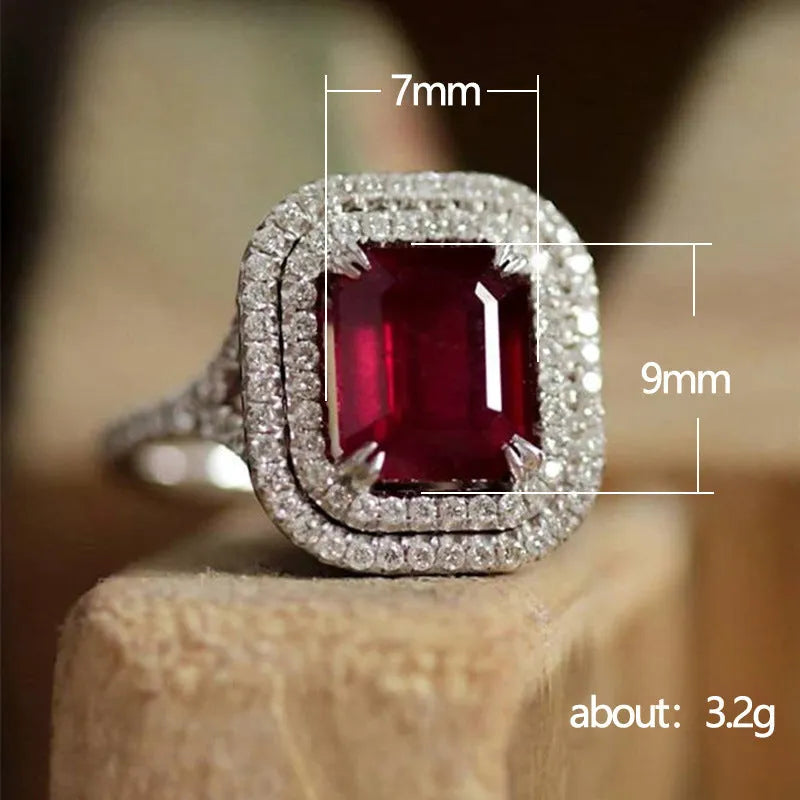 Red copper women's ring with square geometric face and clear rhinestones.