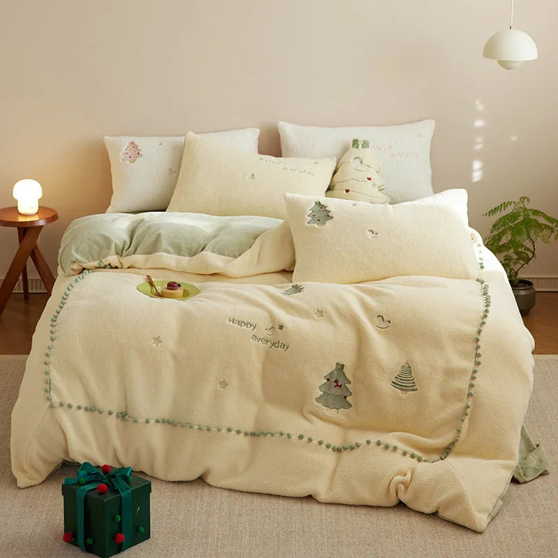 Winter milk fibre bedding four-piece set with green Christmas tree reactive print on a quilt cover and pillowcase.
