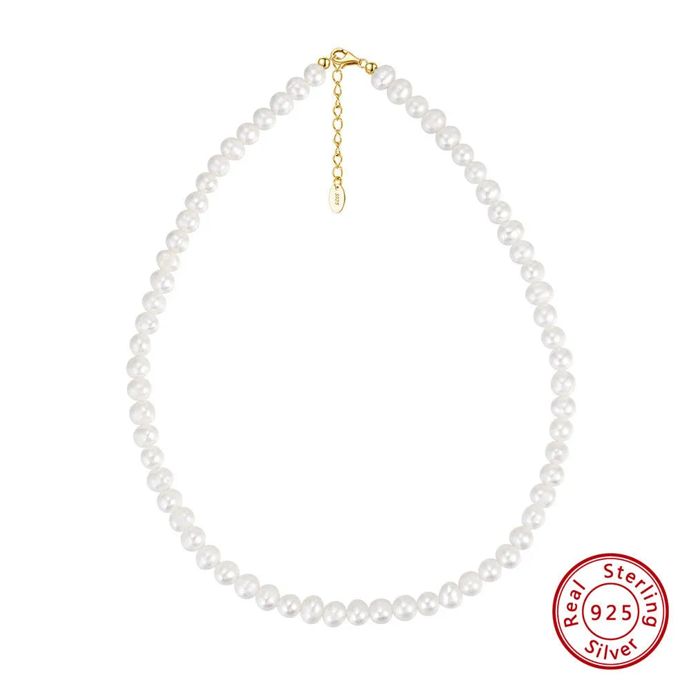 Women's silver necklace with round freshwater pearls on an adjustable chain.