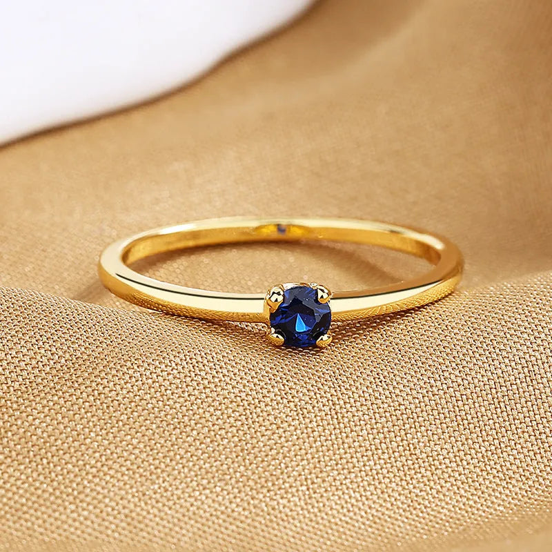 Women's personalised twin style copper geometric circle ring with single diamond in white, red, green, or blue colour
