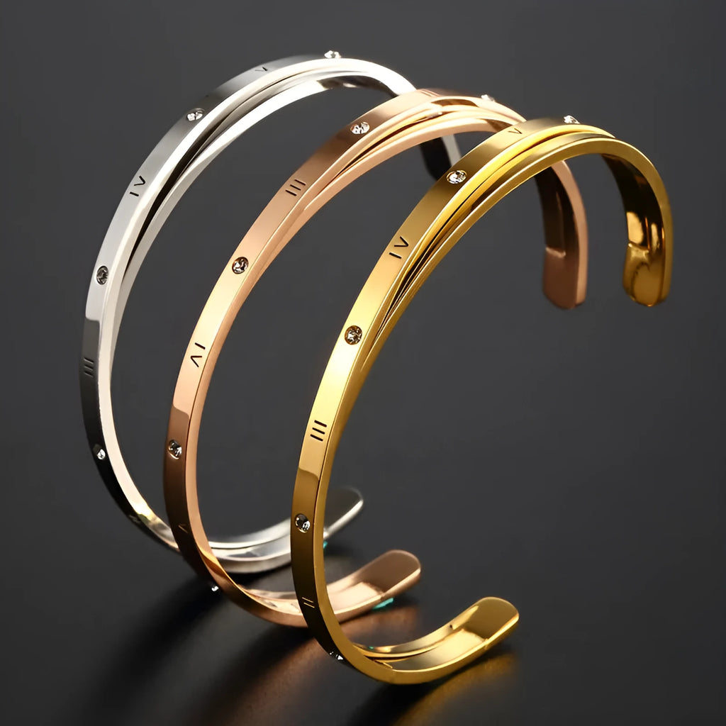 Women's open-ended stainless steel bracelet with inlaid zircon stones in a choice of rose, steel, or gold finish.