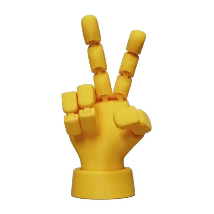 Yellow PLA movable joint hand ornament figurine on a white background.