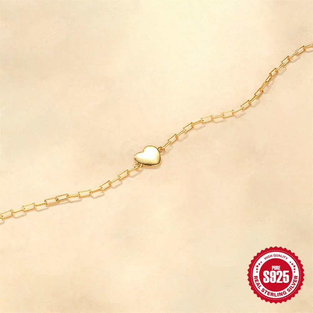 Gold tone S925 sterling silver bracelet with clip chain and glossy heart charm