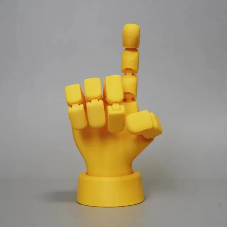 Yellow PLA movable joint hand ornament figurine on a white background.