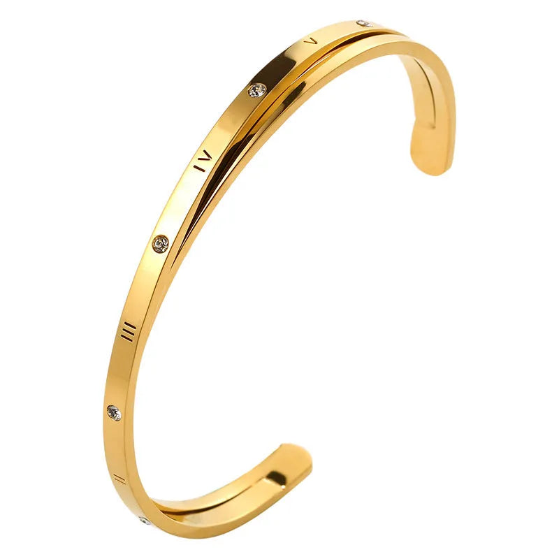 Women's open-ended stainless steel bracelet with inlaid zircon stones in a choice of rose, steel, or gold finish.