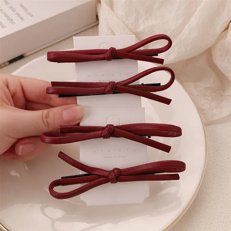 Wine red leather bow barrette hair clip for women, single piece or pair.