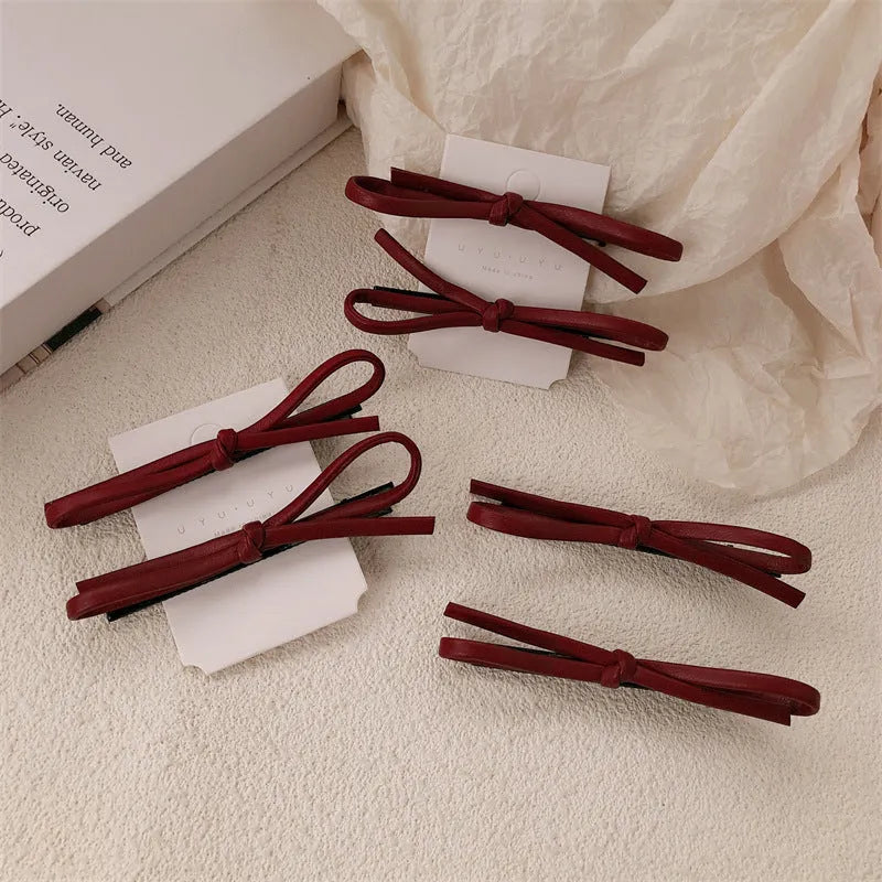 Wine red leather bow barrette hair clip for women, single piece or pair.