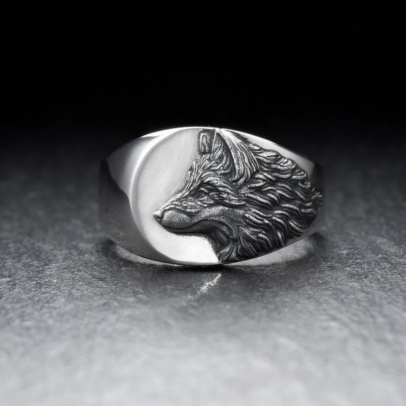 Men's silver geometric wolf head ring in retro style, showing angular alloy construction.