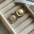 Gold round retro earrings for women with metal construction and circular design
