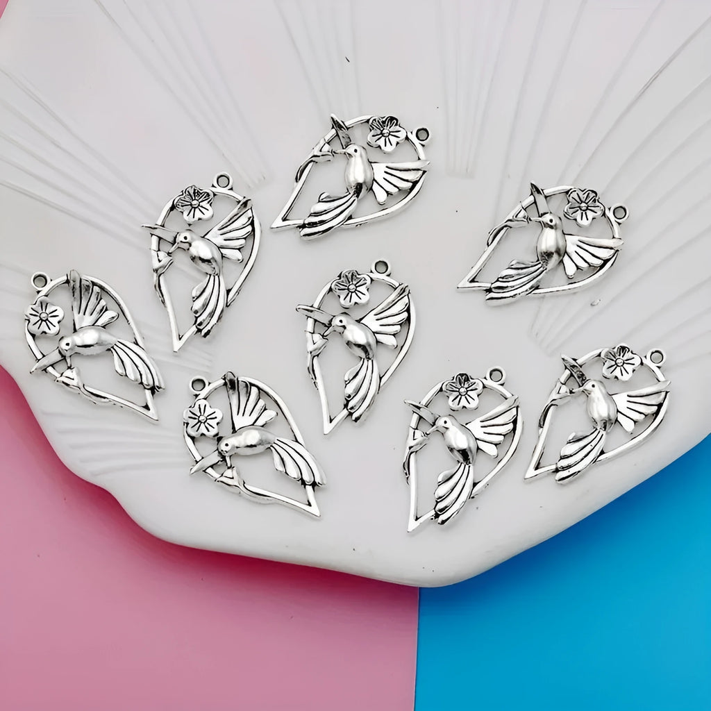 Close-up of an alloy cuckoo magpie pendant with electroplated finish in colour P234 for DIY jewellery.