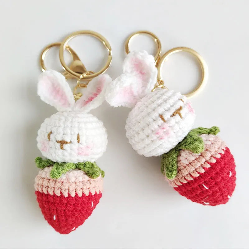 Colourful hand-woven wire rabbit strawberry pendant on a keyring