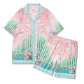 Men's plaid short-sleeve shirt and trouser beach outfit on a hanger.